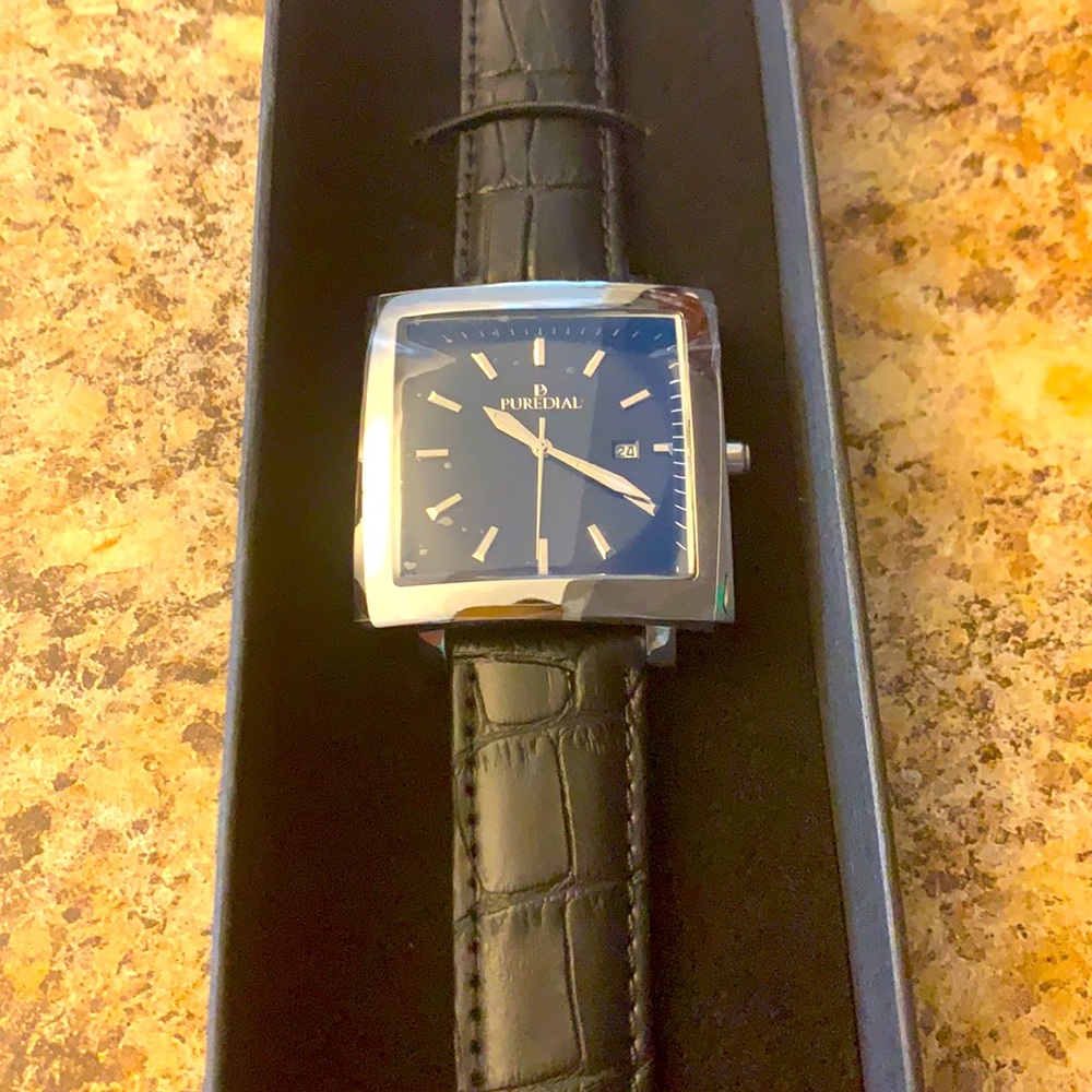 Puredial black leather watch.